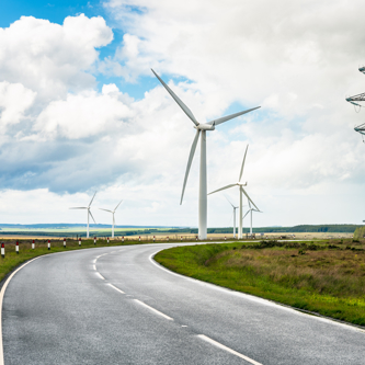 Country road through wind farm