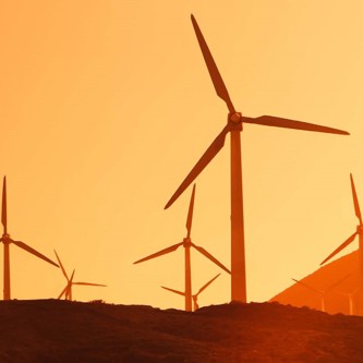 Image of Wind Turbines with sunset